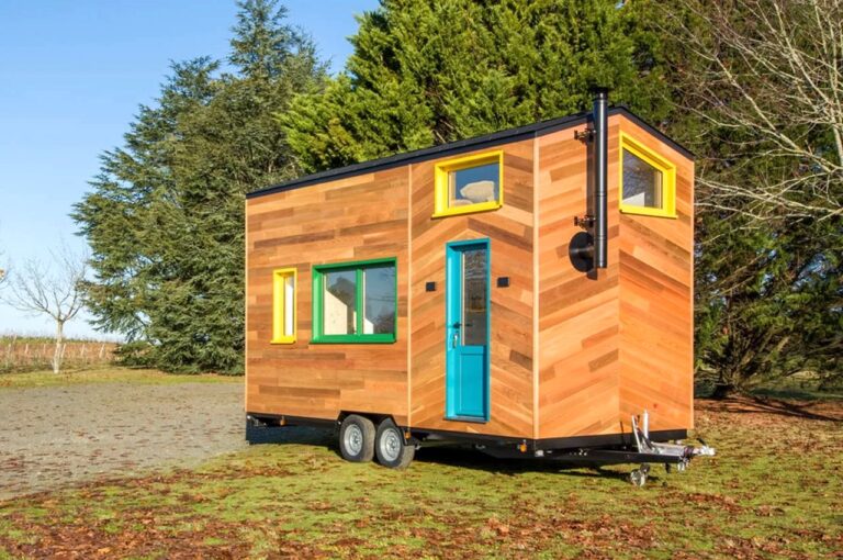 Tiny home on wheels uses colourful windows to create a fun space for a young family via Yanko Design