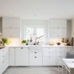 Chic White Kitchen With Indoor Plants